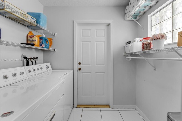 14011 SW 151st Ave, Miami, FL 33196 - washroom featuring washing machine and dryer and light tile patterned floors