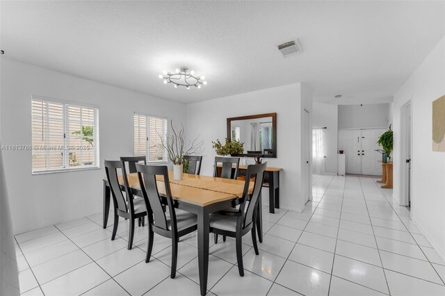 14011 SW 151st Ave, Miami, FL 33196 - dining space with light tile patterned floors and a chandelier
