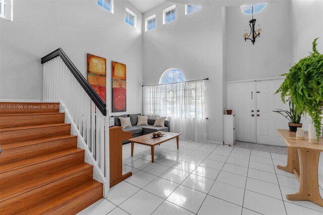 14011 SW 151st Ave, Miami, FL 33196 - entrance foyer featuring a towering ceiling, stairs, and a chandelier