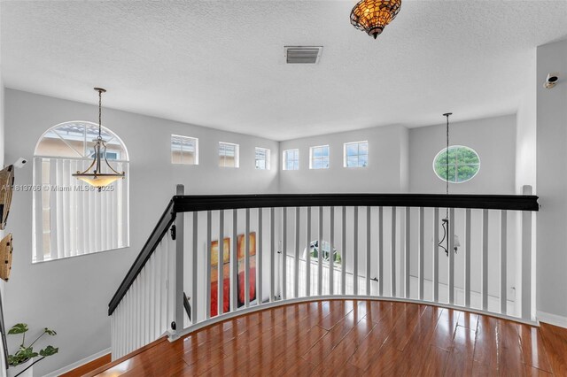 14011 SW 151st Ave, Miami, FL 33196 - corridor with baseboards, wood finished floors, and a textured ceiling