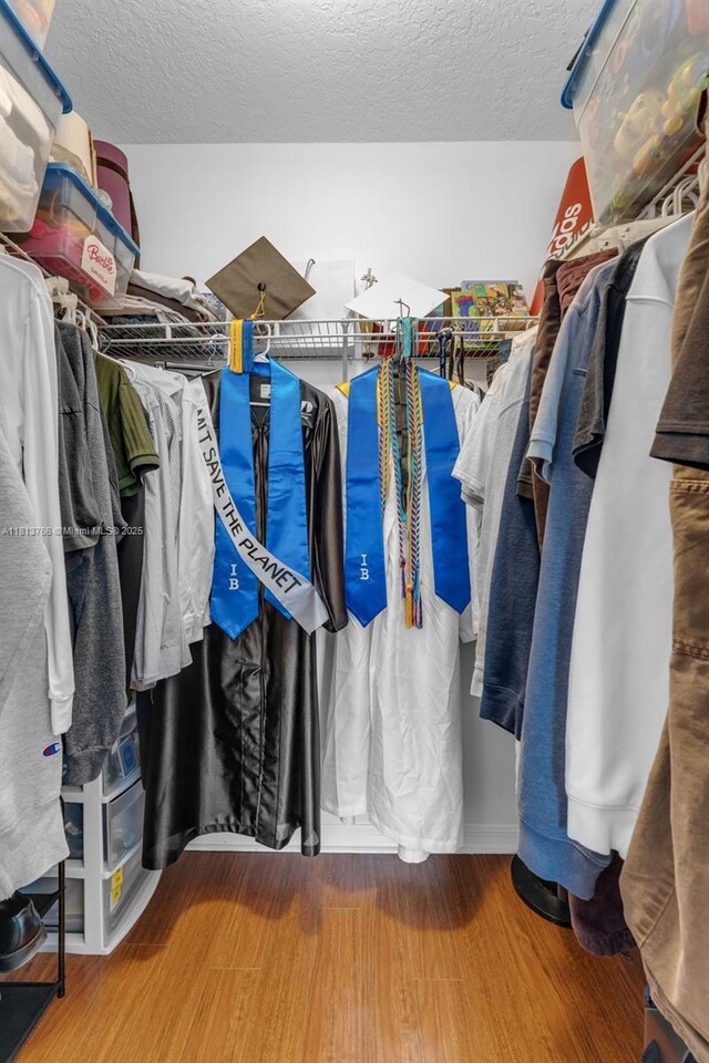 14011 SW 151st Ave, Miami, FL 33196 - walk in closet featuring wood finished floors