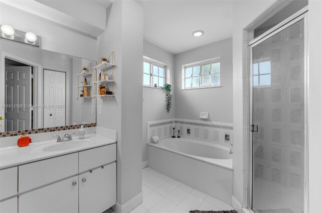 14011 SW 151st Ave, Miami, FL 33196 - full bathroom featuring vanity, a garden tub, a stall shower, and baseboards