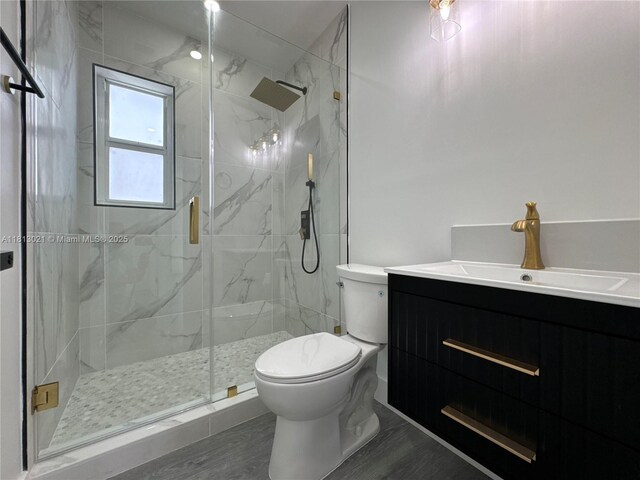 5450 SW 6th St, Miami, FL 33134 - bathroom featuring toilet, vanity, and a marble finish shower