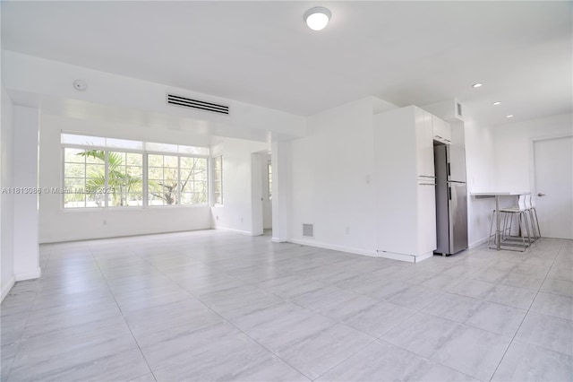 1201 S Biscayne Point Rd, Miami Beach, FL 33141 - empty room featuring baseboards, light tile patterned flooring, and recessed lighting
