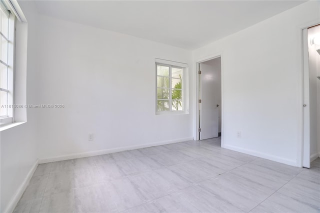 1201 S Biscayne Point Rd, Miami Beach, FL 33141 - empty room with baseboards