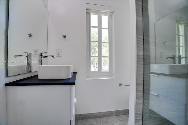1201 S Biscayne Point Rd, Miami Beach, FL 33141 - full bath with double vanity, walk in shower, and baseboards
