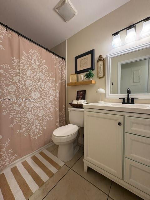 13324 SW 100th Ter, Miami, FL 33186 - bathroom featuring tile patterned floors, toilet, vanity, and a shower with curtain