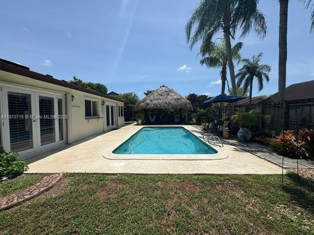 13324 SW 100th Ter, Miami, FL 33186 - view of swimming pool with a patio