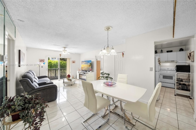4709 NW 7th St Unit 405-9, Miami, FL 33126 - dining space with light tile patterned floors, ceiling fan, a textured ceiling, and a chandelier