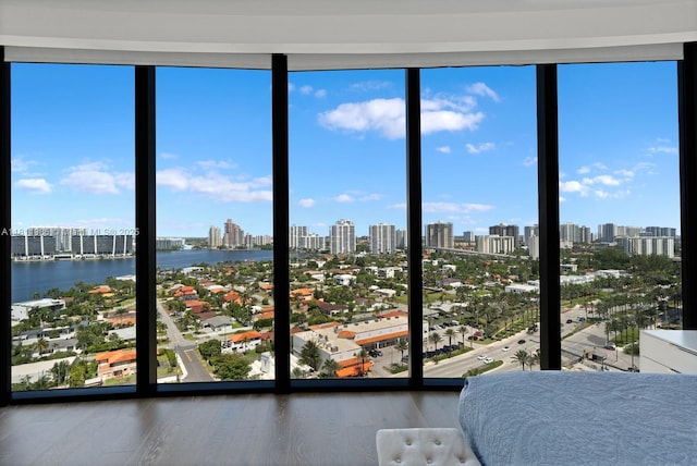 18555 Collins Ave Unit 1703, Sunny Isles Beach, FL 33160 - bedroom featuring a skyline view, multiple windows, and a wall of windows