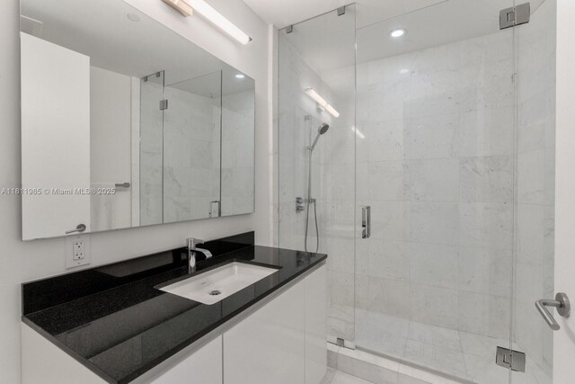 18555 Collins Ave Unit 1703, Sunny Isles Beach, FL 33160 - bathroom featuring vanity, a shower stall, and recessed lighting