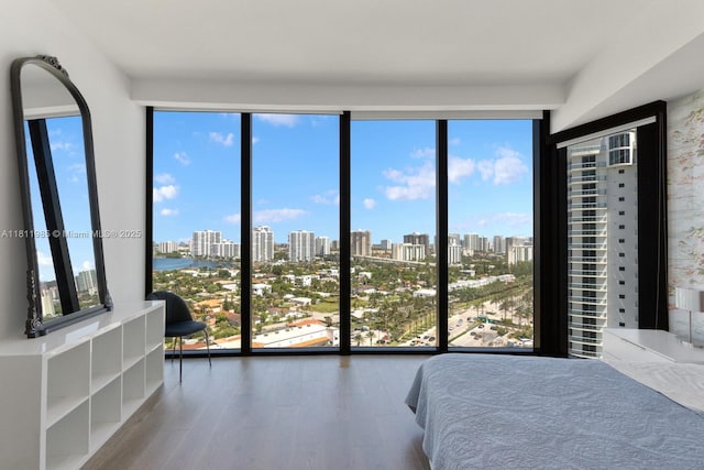 18555 Collins Ave Unit 1703, Sunny Isles Beach, FL 33160 - bedroom with a skyline view and wood finished floors