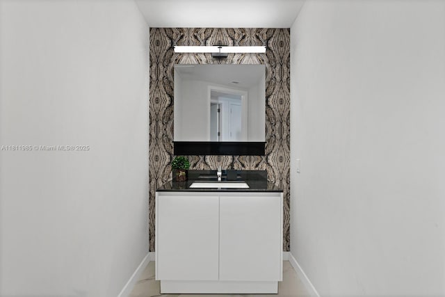 18555 Collins Ave Unit 1703, Sunny Isles Beach, FL 33160 - bathroom featuring baseboards and vanity
