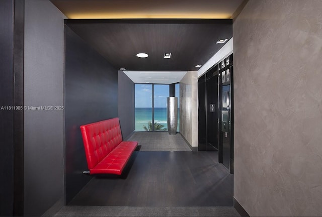 18555 Collins Ave Unit 1703, Sunny Isles Beach, FL 33160 - corridor with a wall of windows, wood finished floors, and recessed lighting