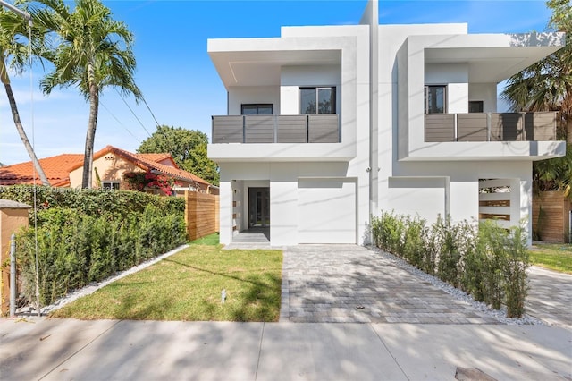 1201 SW 23rd St Right, Unit Right, Miami, FL 33145 - modern home featuring a balcony, stucco siding, decorative driveway, and a garage