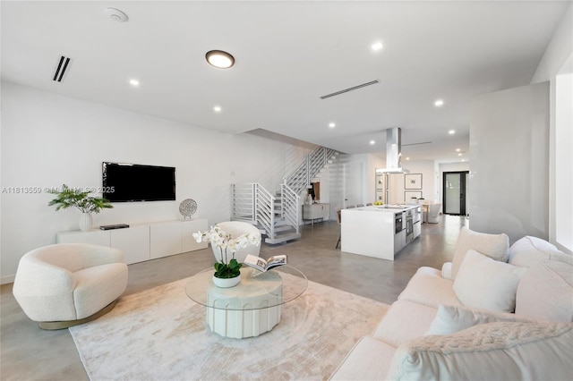 1201 SW 23rd St Right, Unit Right, Miami, FL 33145 - living room with concrete flooring, recessed lighting, and stairs