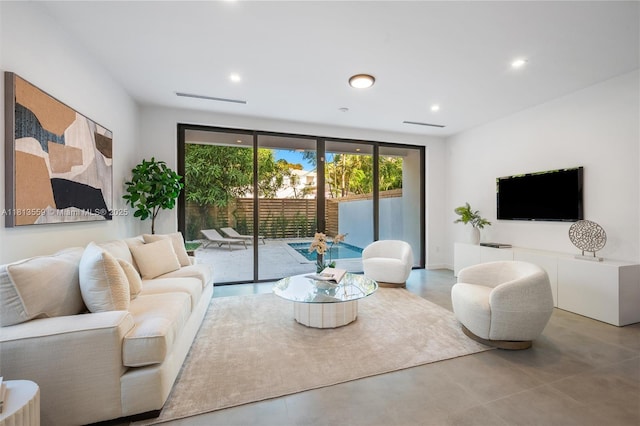 1201 SW 23rd St Right, Unit Right, Miami, FL 33145 - living room with recessed lighting, expansive windows, and concrete flooring