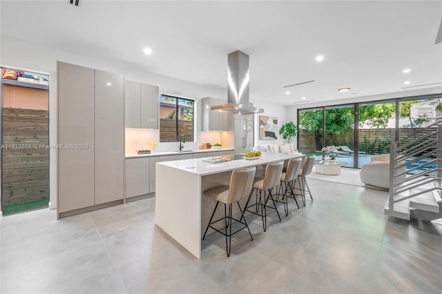 1201 SW 23rd St Right, Unit Right, Miami, FL 33145 - kitchen with island exhaust hood, modern cabinets, a sink, a kitchen island, and healthy amount of natural light