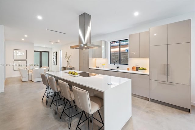 1201 SW 23rd St Right, Unit Right, Miami, FL 33145 - kitchen with island range hood, modern cabinets, a sink, a kitchen island, and a kitchen bar