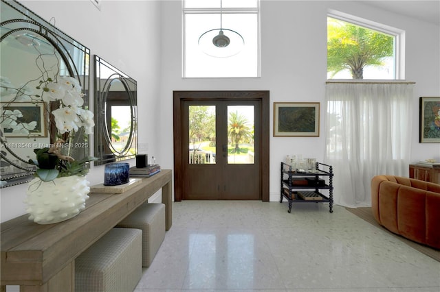 6320 Dolphin Dr, Coral Gables, FL 33158 - entrance foyer with a high ceiling and french doors
