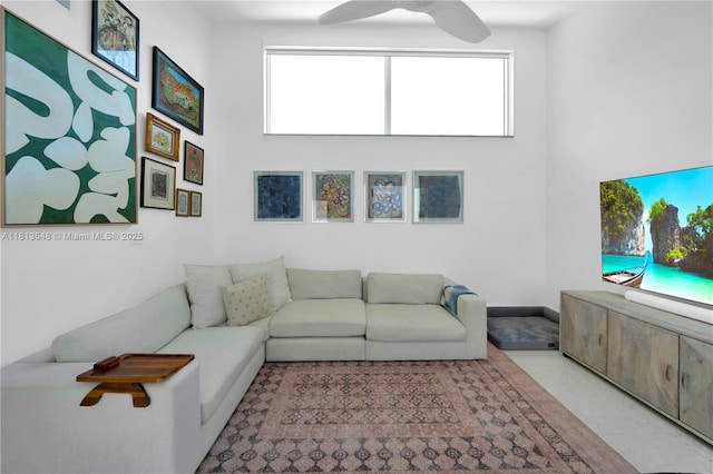 6320 Dolphin Dr, Coral Gables, FL 33158 - living area featuring healthy amount of natural light, a ceiling fan, and a high ceiling