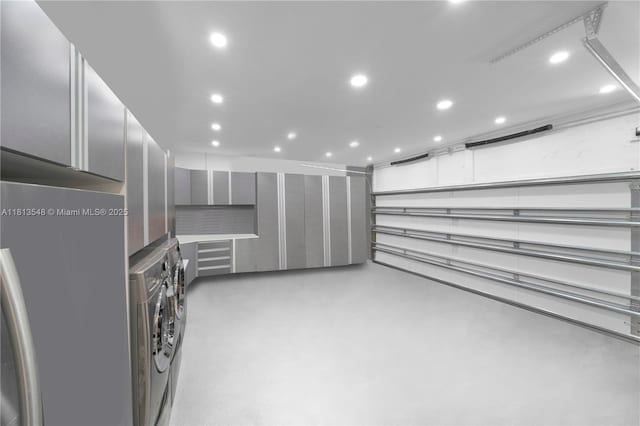 6320 Dolphin Dr, Coral Gables, FL 33158 - walk in closet with washer and dryer and stacked washer and clothes dryer