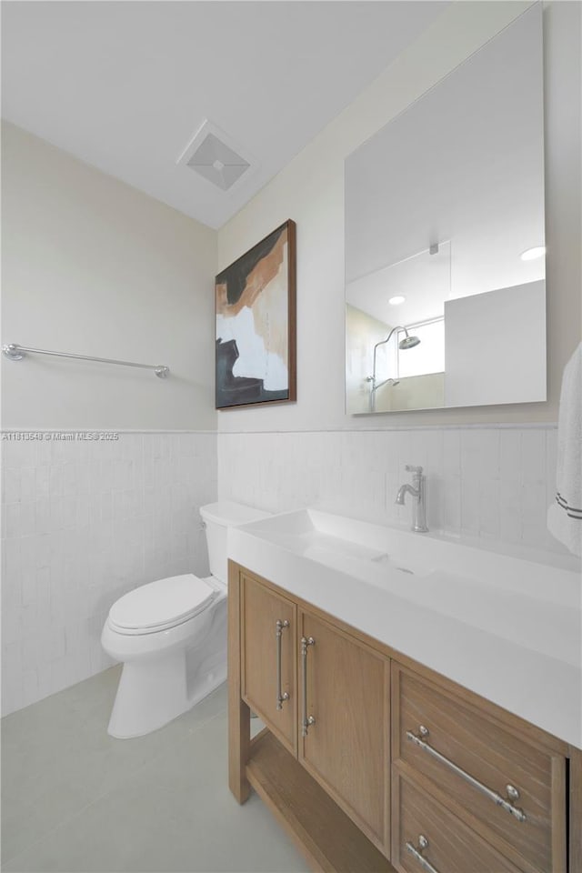 6320 Dolphin Dr, Coral Gables, FL 33158 - full bathroom with vanity, tile walls, wainscoting, and a shower