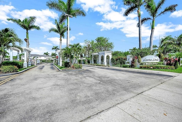 5440NW 107th Ave Unit 204, Doral, FL 33178 - view of road featuring curbs and a gated entry