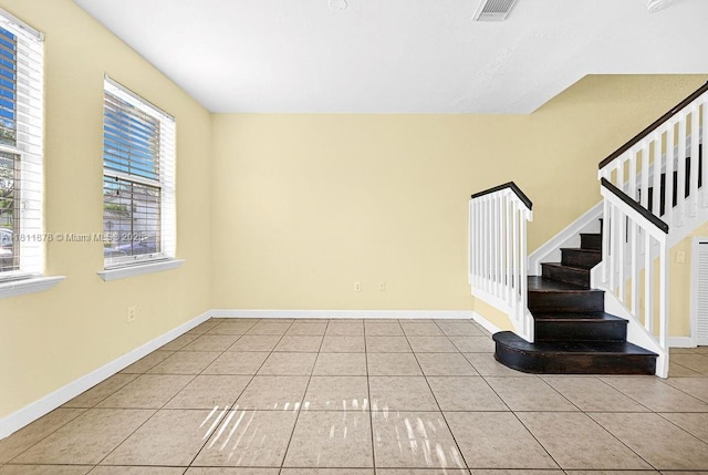 5440NW 107th Ave Unit 204, Doral, FL 33178 - unfurnished room featuring tile patterned floors, stairway, and baseboards