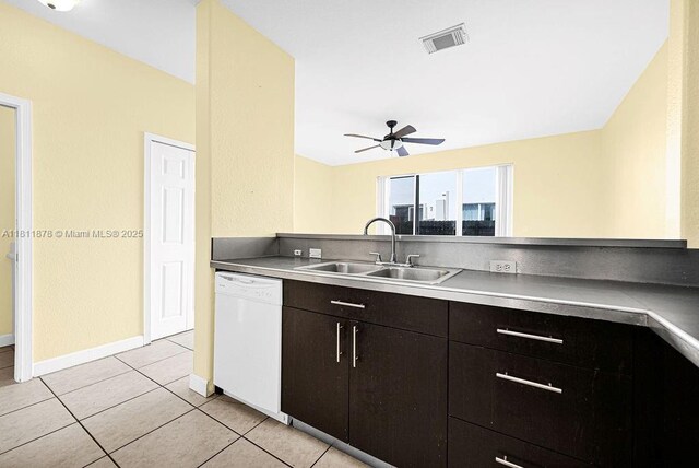 5440NW 107th Ave Unit 204, Doral, FL 33178 - kitchen with white dishwasher, a sink, ceiling fan, light tile patterned flooring, and baseboards