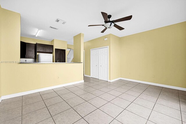 5440NW 107th Ave Unit 204, Doral, FL 33178 - spare room featuring ceiling fan, light tile patterned flooring, and baseboards