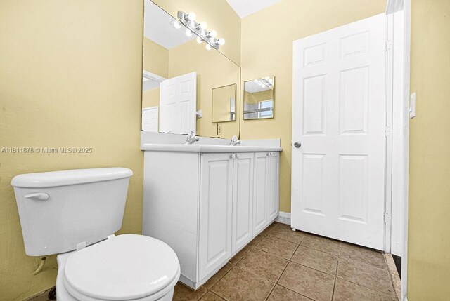 5440NW 107th Ave Unit 204, Doral, FL 33178 - bathroom featuring vanity, tile patterned floors, and toilet
