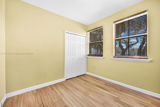 5440NW 107th Ave Unit 204, Doral, FL 33178 - empty room with wood finished floors and baseboards