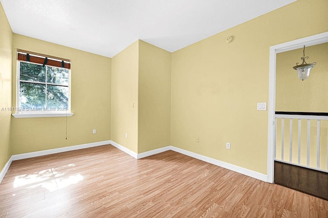 5440NW 107th Ave Unit 204, Doral, FL 33178 - spare room featuring wood finished floors, baseboards, and a smoke detector