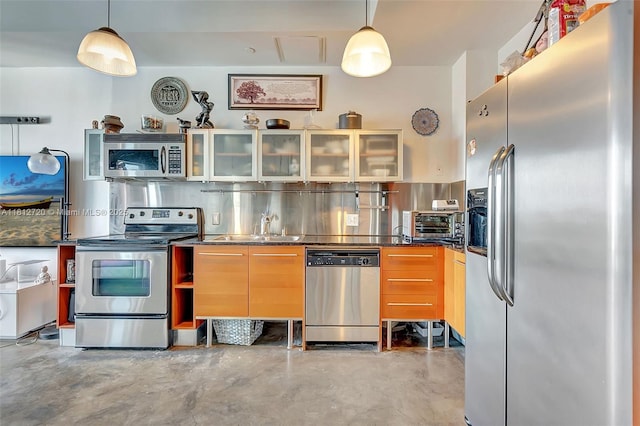 10 SW S River Dr Unit Ph108, Miami, FL 33130 - kitchen with stainless steel appliances, concrete floors, glass insert cabinets, a sink, and dark countertops