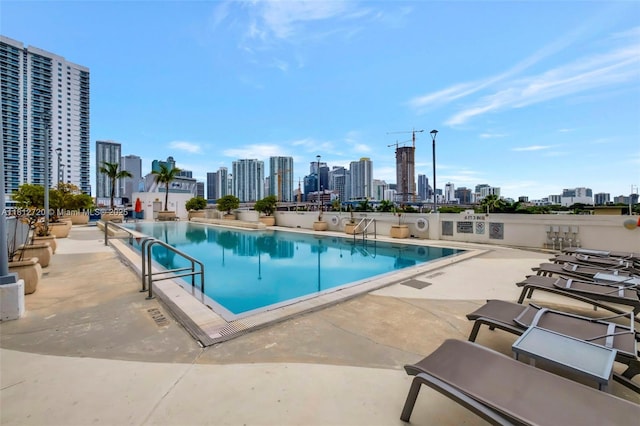 10 SW S River Dr Unit Ph108, Miami, FL 33130 - community pool with a skyline view and a patio