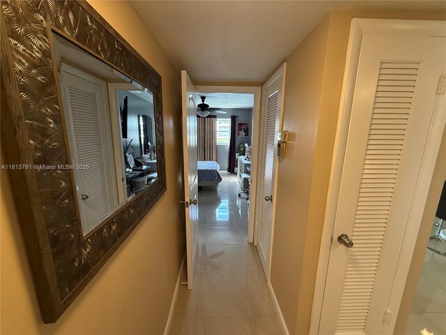 2851 E Sunrise Lakes Dr Unit 205, Sunrise, FL 33322 - corridor featuring baseboards and tile patterned flooring