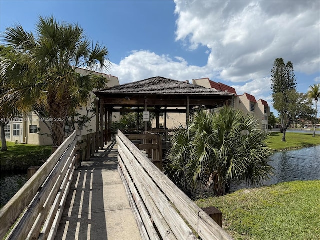 2851 E Sunrise Lakes Dr Unit 205, Sunrise, FL 33322 - deck featuring a gazebo, a water view, and a yard