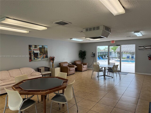 2851 E Sunrise Lakes Dr Unit 205, Sunrise, FL 33322 - dining space with a textured ceiling and light tile patterned flooring
