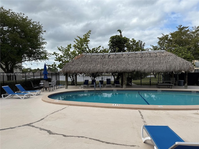 2851 E Sunrise Lakes Dr Unit 205, Sunrise, FL 33322 - community pool with a gazebo and a patio area