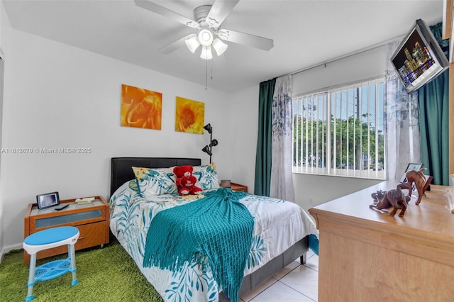 401 SW 109th Ave Unit 26, Sweetwater, FL 33174 - bedroom with a ceiling fan and tile patterned flooring