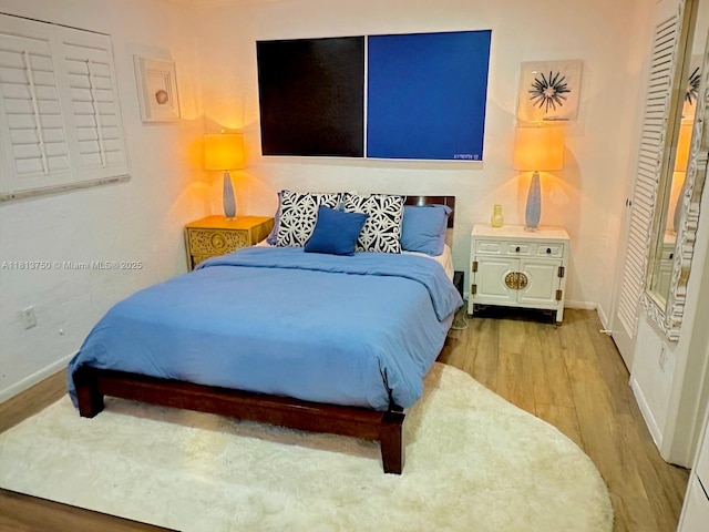 928 NE 18th Ct, Fort Lauderdale, FL 33305 - bedroom featuring wood finished floors and baseboards