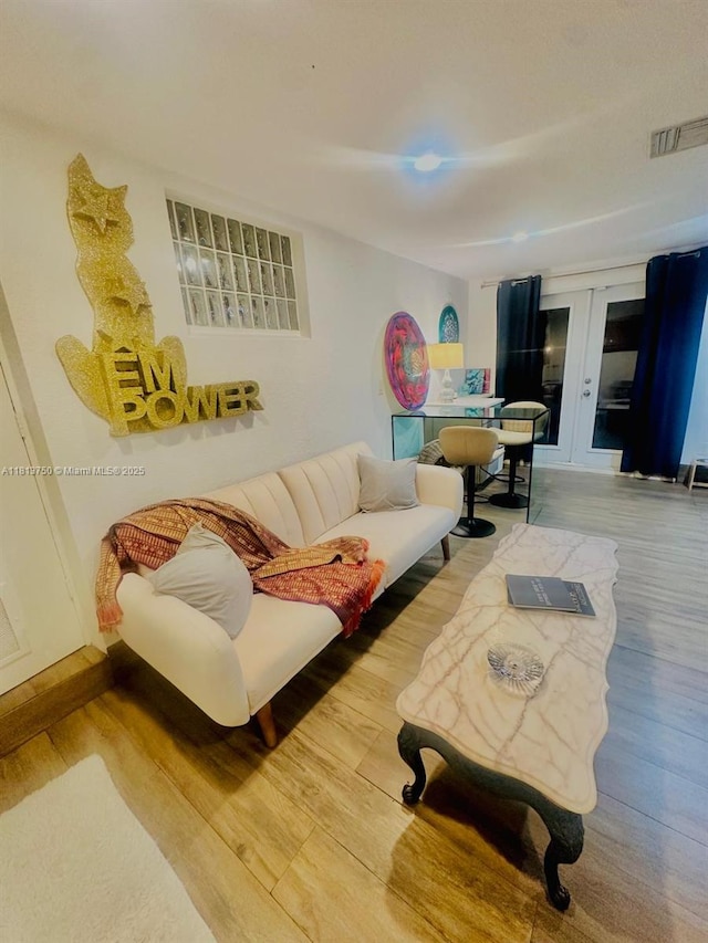 928 NE 18th Ct, Fort Lauderdale, FL 33305 - living room with wood finished floors and french doors