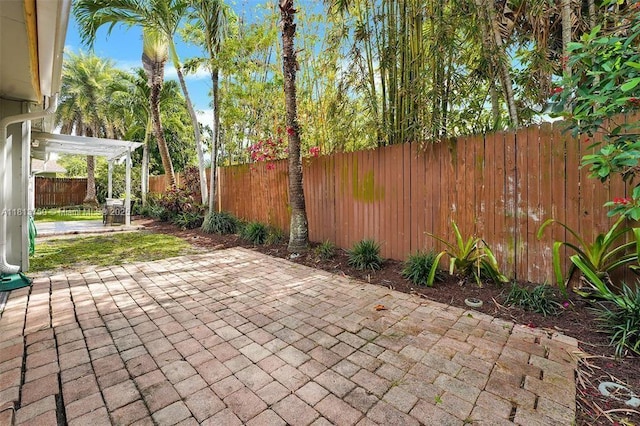 928 NE 18th Ct, Fort Lauderdale, FL 33305 - fenced backyard featuring a patio