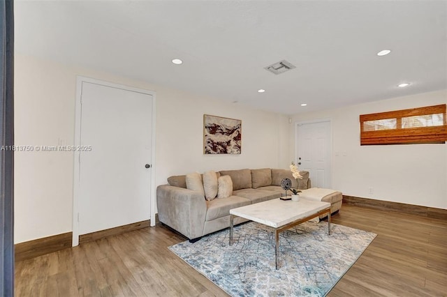 928 NE 18th Ct, Fort Lauderdale, FL 33305 - living area featuring baseboards, wood finished floors, and recessed lighting