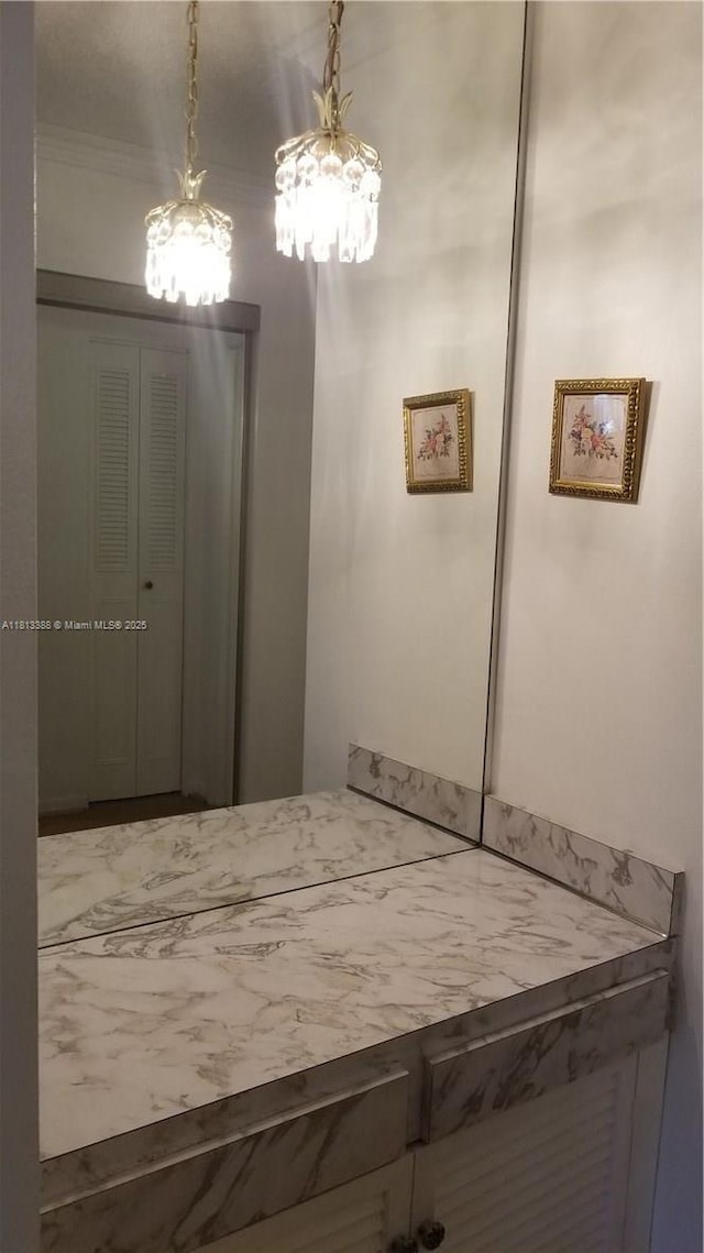 4880 NW 22nd St Unit 207, Lauderhill, FL 33313 - bathroom featuring a chandelier