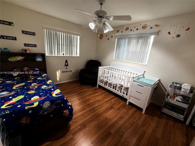 2430 N 61st Ter, Hollywood, FL 33024 - bedroom featuring wood finished floors, multiple windows, a ceiling fan, and baseboards