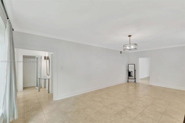 276 NE 90th St, El Portal, FL 33138 - unfurnished room with a chandelier, baseboards, and crown molding