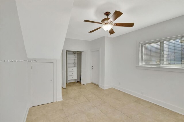 276 NE 90th St, El Portal, FL 33138 - unfurnished bedroom with baseboards, a ceiling fan, and light tile patterned flooring