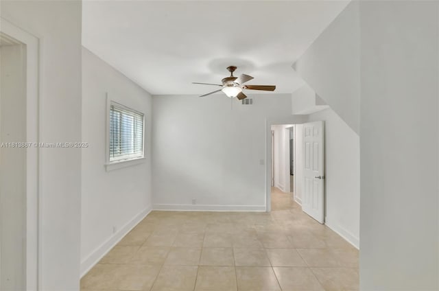 276 NE 90th St, El Portal, FL 33138 - spare room featuring a ceiling fan, light tile patterned floors, and baseboards